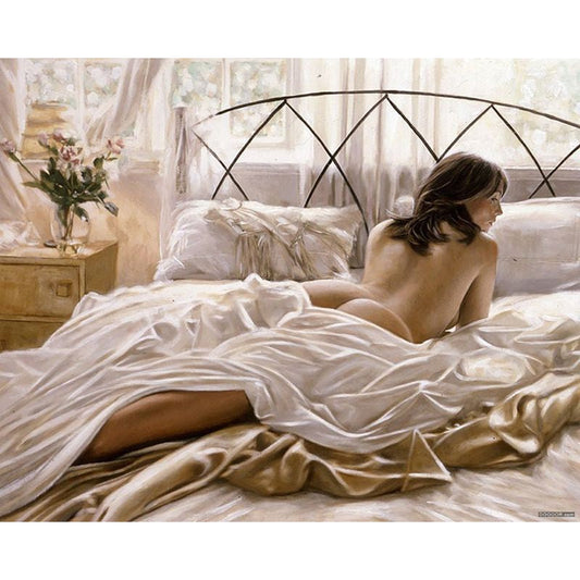 Frau auf dem Bett